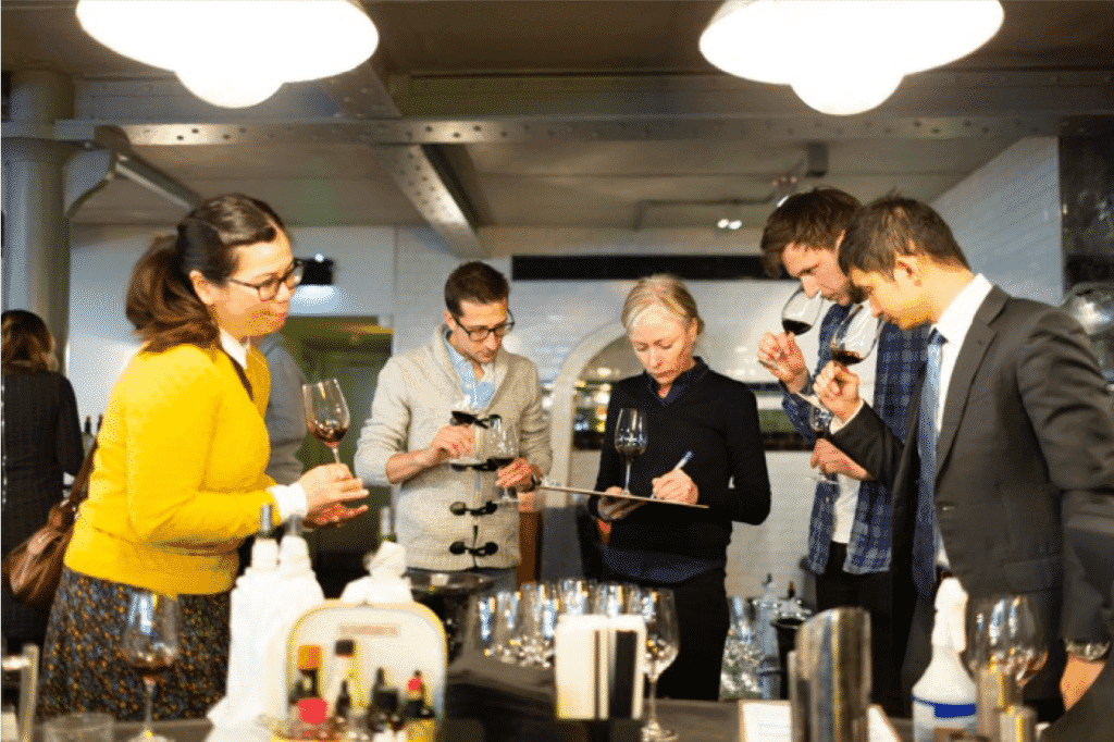 Wine tasting event with participants engaged.