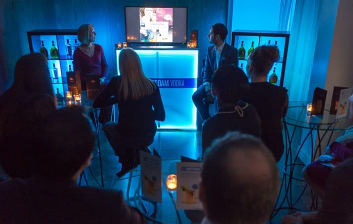 Audience watching presentation in dim lighting