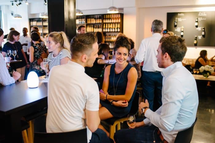 People socialising in a wine bar.