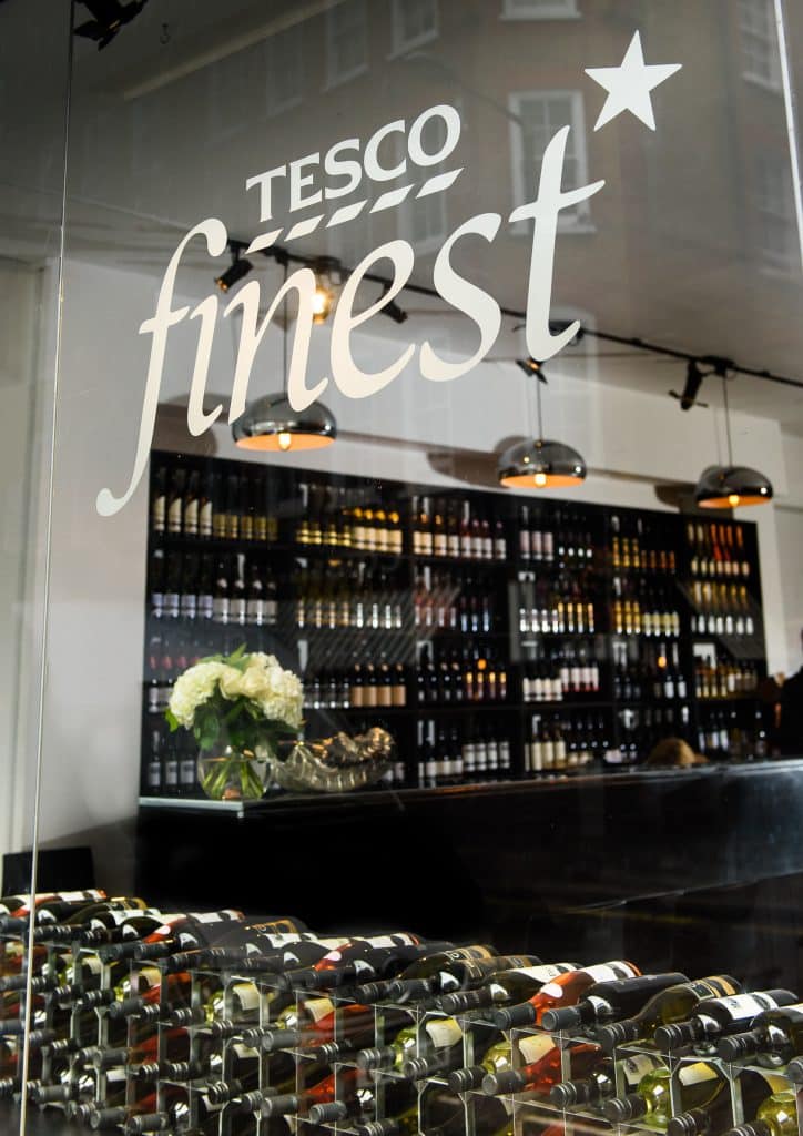 Wine bottles displayed in stylish bar.