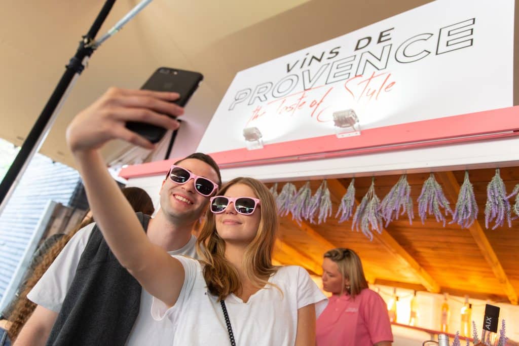 Couple taking selfie at wine bar